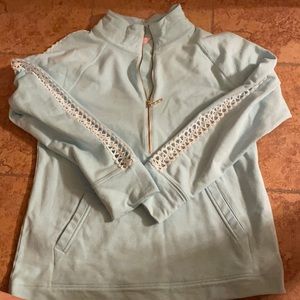 Light blue popover with lace on sleeves